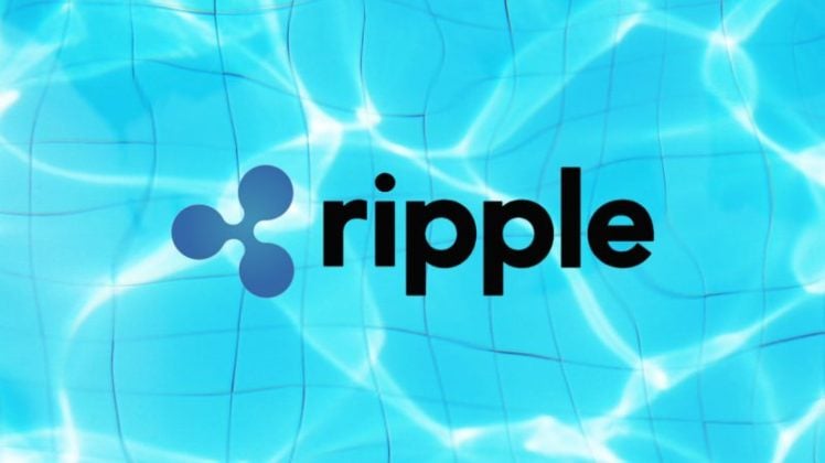 The logo of Ripple (XRP) on top of water