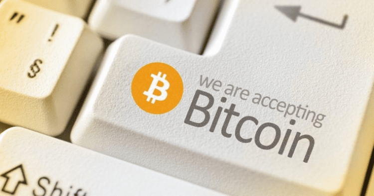A sign on computer keyboard to illustrate businesses that accept Bitcoin in South Africa